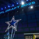 Apr 24, 2025; Green Bay, WI, USA; The Dallas Cowboys logo is projected on the video board during the NFL Draft at Lambeau Field. Mandatory Credit: Kirby Lee-Imagn Images