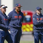 May 9, 2025; Lake Forest, IL, USA; Chicago Bears defensive coordinator Dennis Allen (L), general manager Ryan Poles (C) and head coach Ben Johnson (R) observe during the Rookie Minicamp at Halas Hall.