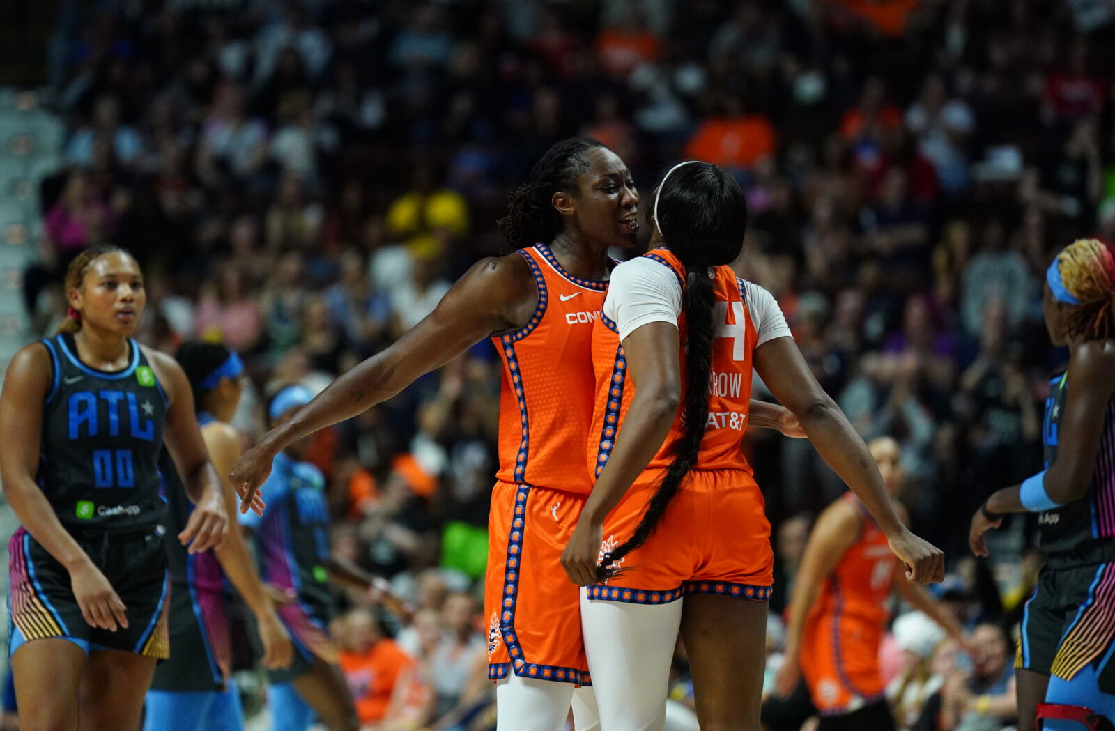 Jun 6, 2025; Uncasville, Connecticut, USA; Connecticut Sun center Tina Charles (31) and forward Aneesah Morrow (24) react after a play against the Atlanta Dream in the second half at Mohegan Sun Arena.