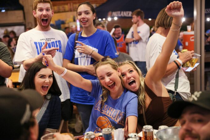 Thunder fans pose for a photo during a watch party for Game 6 of the NBA Finals at Fassler Hall in Oklahoma City, Thursday, June 19, 2025.