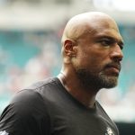 Oct 12, 2025; Miami Gardens, Florida, USA; Miami Dolphins defensive coordinator Anthony Weaver leaves the field after a game between the Miami Dolphins and the Los Angeles Chargers at Hard Rock Stadium. Mandatory Credit: Rich Storry-Imagn Images
