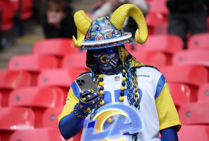 Oct 19, 2025; London, England; Los Angeles Rams fan looks at their phone before a NFL International Series game between the Los Angeles Rams and the Jacksonville Jaguars at Wembley Stadium. Mandatory Credit: Andrew Boyers-Reuters via Imagn Images
