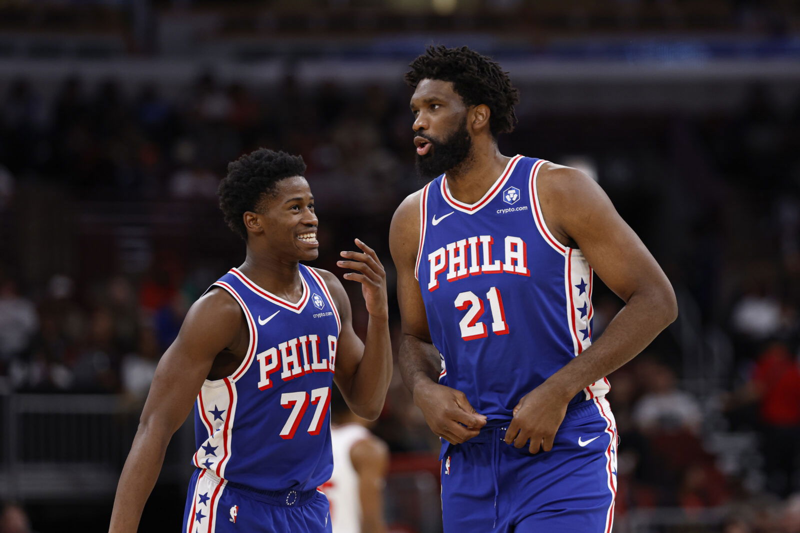 Nov 4, 2025; Chicago, Illinois, USA; Philadelphia 76ers guard VJ Edgecombe (77) chats with center Joel Embiid (21) during the first half of an NBA game against the Chicago Bulls at United Center. Mandatory Credit: Kamil Krzaczynski-Imagn Images