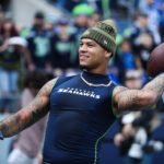 Nov 9, 2025; Seattle, Washington, USA; Seattle Seahawks safety Coby Bryant (8) warms up before the game against the Arizona Cardinals at Lumen Field. Mandatory Credit: Kevin Ng-Imagn Images