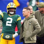 Nov 16, 2025; East Rutherford, New Jersey, USA; Green Bay Packers quarterback Malik Willis (2) talks with head coach Matt LaFleur before the game against the New York Giants at MetLife Stadium.
