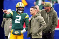 Nov 16, 2025; East Rutherford, New Jersey, USA; Green Bay Packers quarterback Malik Willis (2) talks with head coach Matt LaFleur before the game against the New York Giants at MetLife Stadium.