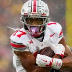 Ohio State Buckeyes wide receiver Carnell Tate (17) runs in a touchdown against the Michigan Wolverines in the second half of the NCAA football game at Michigan Stadium on Saturday, Nov. 29, 2025 in Ann Arbor, Michigan.
