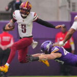 Dec 7, 2025; Minneapolis, Minnesota, USA; Washington Commanders quarterback Jayden Daniels (5) rushes the ball past Minnesota Vikings outside linebacker Andrew van Ginkel (43) during the first half at U.S. Bank Stadium. Mandatory Credit: Brad Rempel-Imagn Images
