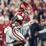Dec 19, 2025; Norman, OK, USA; Oklahoma Sooners wide receiver Deion Burks (4) against the Alabama Crimson Tide during the CFP National Playoff First Round at Gaylord Family Oklahoma Memorial Stadium. Mandatory Credit: Mark J. Rebilas-Imagn Images