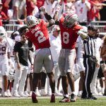 Ohio State Buckeyes safety Caleb Downs (2) and linebacker Arvell Reese (8) celebrate during the NCAA football game against the Texas Longhorns at Ohio Stadium on Aug. 30, 2025.