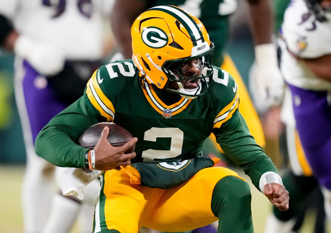 Dec 27, 2025; Green Bay, Wisconsin, USA; Green Bay Packers quarterback Malik Willis (2) runs the ball during the third quarter against the Baltimore Ravens at Lambeau Field. Mandatory Credit: Kayla Wolf-Imagn Images