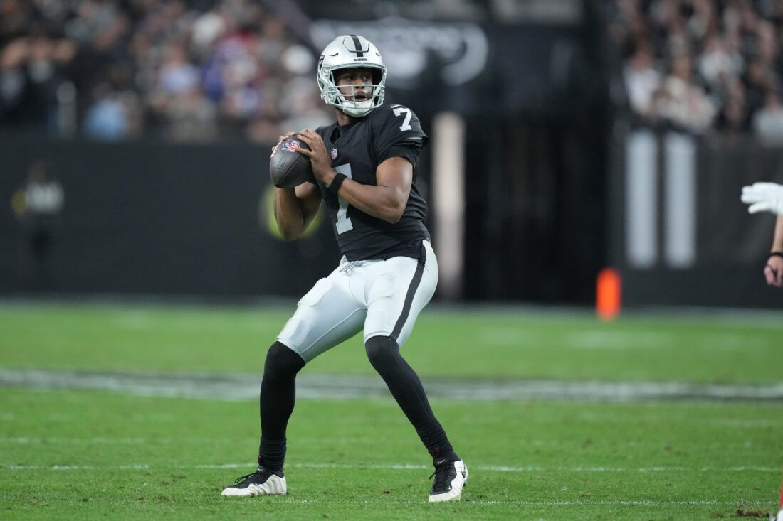 Dec 28, 2025; Paradise, Nevada, USA; Las Vegas Raiders quarterback Geno Smith (7) looks to throw in the third quarter against the New York Giants at Allegiant Stadium. Mandatory Credit: