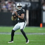 Dec 28, 2025; Paradise, Nevada, USA; Las Vegas Raiders quarterback Geno Smith (7) looks to throw in the third quarter against the New York Giants at Allegiant Stadium. Mandatory Credit: