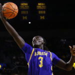 Dec 29, 2025; Ann Arbor, Michigan, USA; McNeese Cowboys guard Garwey Dual (3) shoots in the second half against the Michigan Wolverines at Crisler Center. Mandatory Credit: Rick Osentoski-Imagn Images