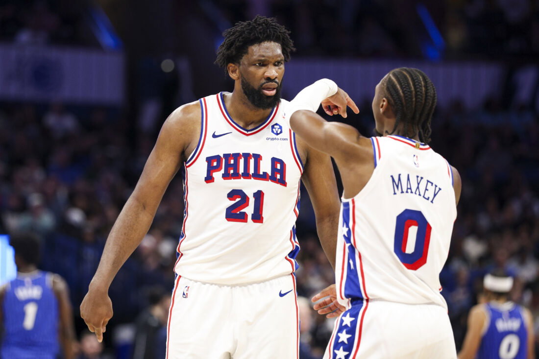 Jan 9, 2026; Orlando, Florida, USA; Philadelphia 76ers center Joel Embiid (21) reacts to guard Tyrese Maxey (0) against the Orlando Magic in the third quarter at Kia Center. Mandatory Credit: Nathan Ray Seebeck-Imagn Images