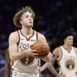 Jan 9, 2026; San Francisco, California, USA; Golden State Warriors guard Brandin Podziemski (2) shoots a free throw against the Sacramento Kings during the fourth quarter at Chase Center. Mandatory Credit: Kelley L Cox-Imagn Images