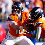Jan 17, 2026; Denver, CO, USA; Denver Broncos quarterback Bo Nix (10) hands off to running back RJ Harvey (12) during the first quarter of an AFC Divisional Round playoff game against the Buffalo Bills at Empower Field at Mile High. Mandatory Credit: Ron Chenoy-Imagn Images