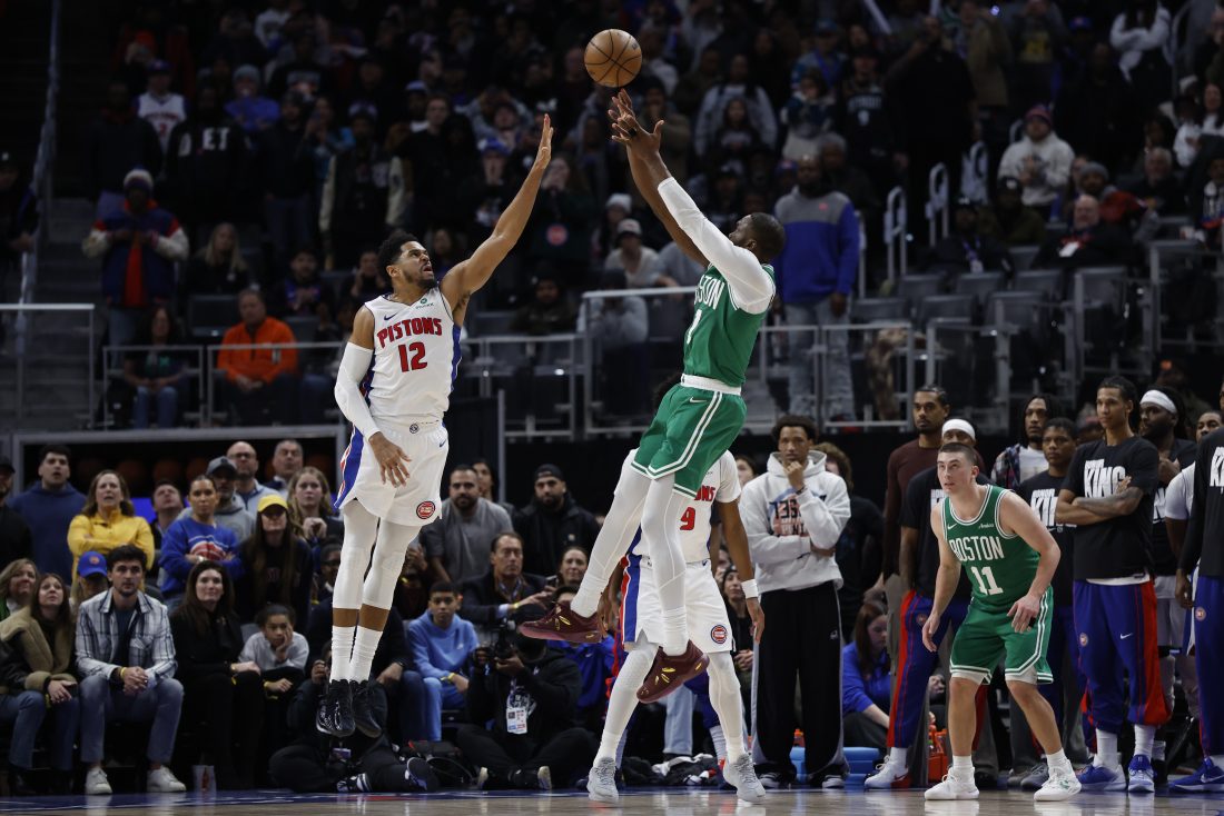 Jan 19, 2026; Detroit, Michigan, USA; Boston Celtics guard Jaylen Brown (7) shoots the ball against Detroit Pistons forward Tobias Harris (12) in the second half at Little Caesars Arena. Mandatory Credit: Rick Osentoski-Imagn Images