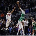 Jan 19, 2026; Detroit, Michigan, USA; Boston Celtics guard Jaylen Brown (7) shoots the ball against Detroit Pistons forward Tobias Harris (12) in the second half at Little Caesars Arena. Mandatory Credit: Rick Osentoski-Imagn Images