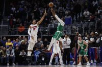 Jan 19, 2026; Detroit, Michigan, USA; Boston Celtics guard Jaylen Brown (7) shoots the ball against Detroit Pistons forward Tobias Harris (12) in the second half at Little Caesars Arena. Mandatory Credit: Rick Osentoski-Imagn Images