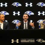 Jan 29, 2026; Owings Mills, MD, USA; Sashi Brown, Jesse Minter, and Eric DeCosta on the podium at the press conference introducing Jesse Minter at Under Armour Performance Center. Mandatory Credit: Lexi Thompson-Imagn Images