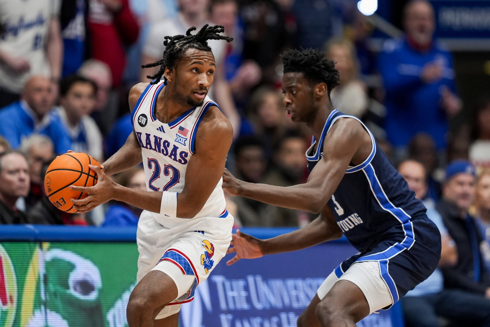 Jan 24, 2026; Columbia, Missouri, USA; Kansas Jayhawks guard Darryn Peterson (22) looks to pass against BYU Cougars forward AJ Dybantsa (3) during the first half at Mizzou Arena. Mandatory Credit: Jay Biggerstaff-Imagn Images