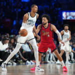 Feb 15, 2026; Inglewood, California, USA; Team World center Victor Wembanyama (1) of the San Antonio Spurs controls the ball while defend by Team USA Stars guard Cade Cunningham (2) of the Detroit Pistons in game one during the 75th NBA All Star Game at Intuit Dome. Mandatory Credit: Kirby Lee-Imagn Images