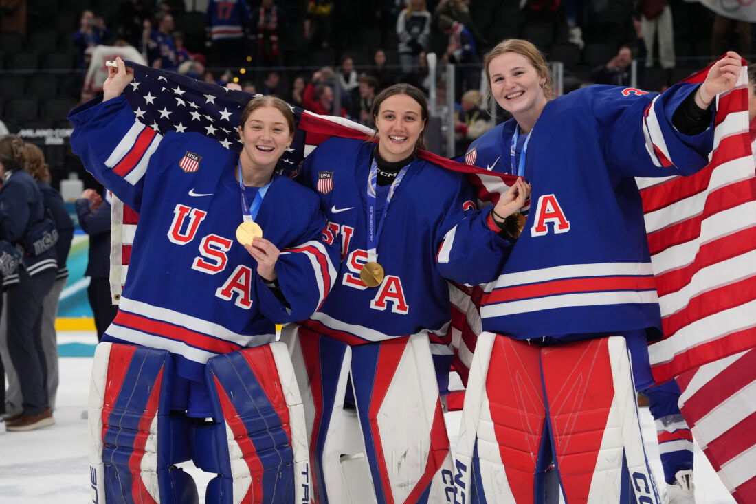Feb 19, 2026; Milan, Italy; Aerin Frankel (31) of the United States, Gwyneth Philips (33) of the United States and Ava McNaughton (30) of the United States celebrate after winning the gold medal in women's ice hockey after defeating Canada during the Milano Cortina 2026 Olympic Winter Games at Milano Santagiulia Ice Hockey Arena. Mandatory Credit: Amber Searls-Imagn Images