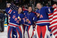 Feb 19, 2026; Milan, Italy; Aerin Frankel (31) of the United States, Gwyneth Philips (33) of the United States and Ava McNaughton (30) of the United States celebrate after winning the gold medal in women's ice hockey after defeating Canada during the Milano Cortina 2026 Olympic Winter Games at Milano Santagiulia Ice Hockey Arena. Mandatory Credit: Amber Searls-Imagn Images