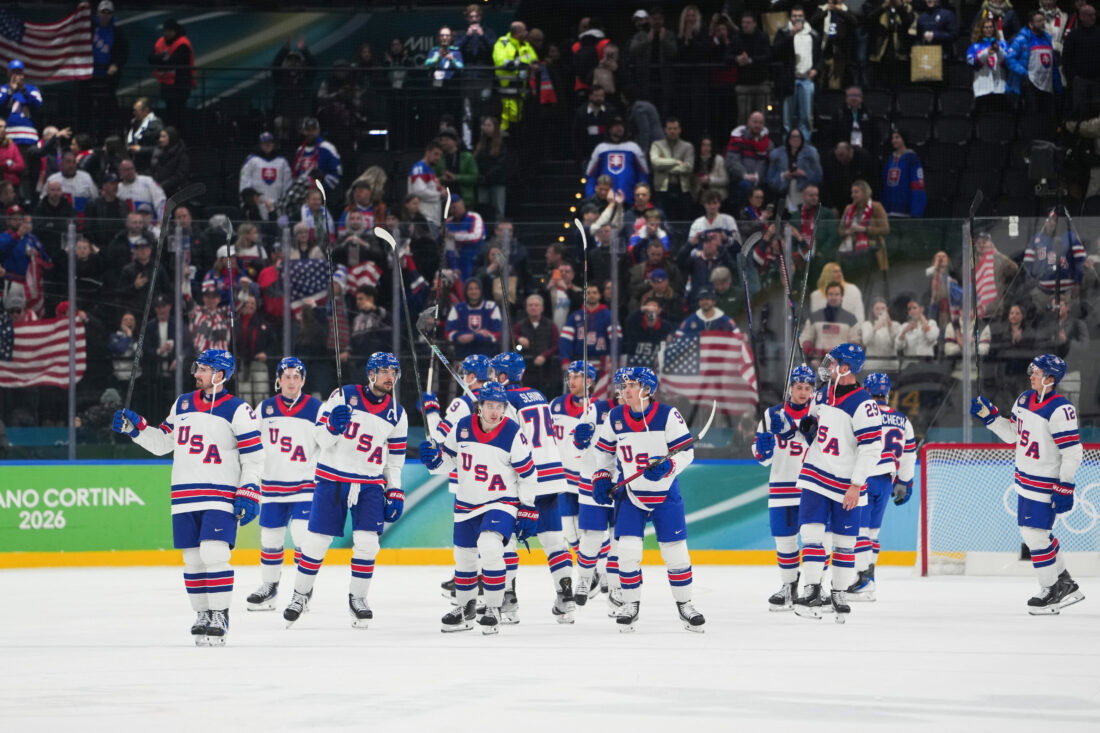 Feb 20, 2026; Milan, Italy; The United States celebrate after the game against Slovakia in a men's ice hockey semifinal during the Milano Cortina 2026 Olympic Winter Games at Milano Santagiulia Ice Hockey Arena. Mandatory Credit: James Lang-Imagn Images