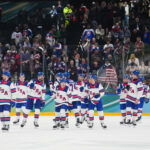 Feb 20, 2026; Milan, Italy; The United States celebrate after the game against Slovakia in a men's ice hockey semifinal during the Milano Cortina 2026 Olympic Winter Games at Milano Santagiulia Ice Hockey Arena. Mandatory Credit: James Lang-Imagn Images