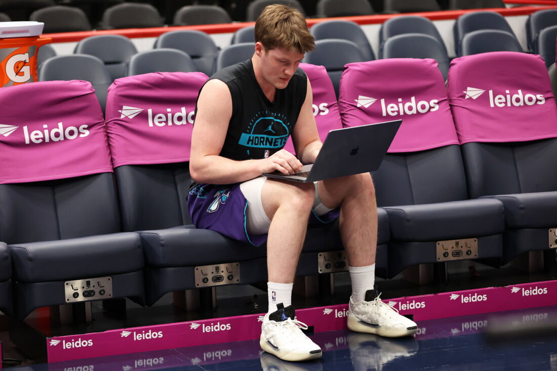 Feb 22, 2026; Washington, District of Columbia, USA; Charlotte Hornets guard Kon Knueppel (7) works on a computer before a game against the Washington Wizards at Capital One Arena. Mandatory Credit: Daniel Kucin Jr.-Imagn Images
