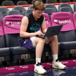 Feb 22, 2026; Washington, District of Columbia, USA; Charlotte Hornets guard Kon Knueppel (7) works on a computer before a game against the Washington Wizards at Capital One Arena. Mandatory Credit: Daniel Kucin Jr.-Imagn Images