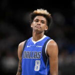 Feb 26, 2026; Dallas, Texas, USA; Dallas Mavericks guard AJ Johnson (8) looks on during the second half against the Sacramento Kings at the American Airlines Center. Mandatory Credit: Jerome Miron-Imagn Images