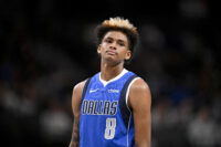 Feb 26, 2026; Dallas, Texas, USA; Dallas Mavericks guard AJ Johnson (8) looks on during the second half against the Sacramento Kings at the American Airlines Center. Mandatory Credit: Jerome Miron-Imagn Images