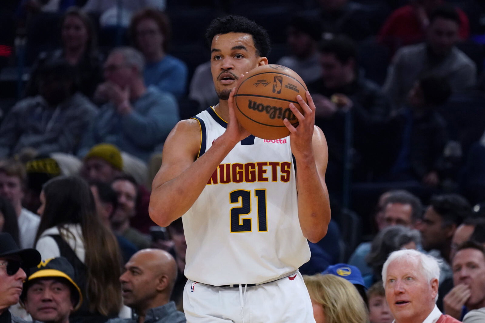 Feb 22, 2026; San Francisco, California, USA; Denver Nuggets forward Spencer Jones (21) looks to pass in the second quarter against the Golden State Warriors at Chase Center.