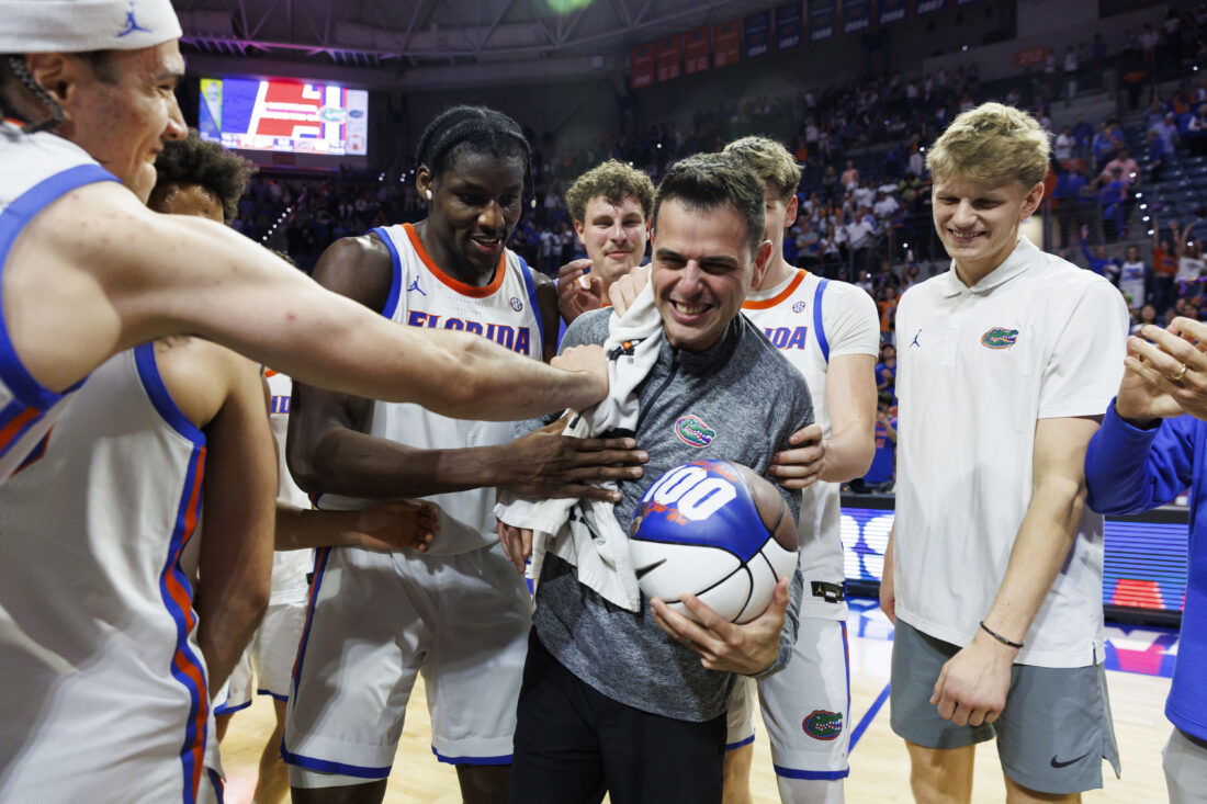 Mar 3, 2026; Gainesville, Florida, USA; Florida Gators head coach Todd Golden celebrates his 100th win with center Viktor Mikic (12), center Rueben Chinyelu (9), center Micah Handlogten (3), forward Alex Condon (21) and forward Thomas Haugh (10) after the game against the Mississippi State Bulldogs at Exactech Arena at the Stephen C. O'Connell Center. Mandatory Credit: Morgan Tencza-Imagn Images