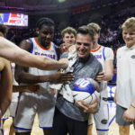 Mar 3, 2026; Gainesville, Florida, USA; Florida Gators head coach Todd Golden celebrates his 100th win with center Viktor Mikic (12), center Rueben Chinyelu (9), center Micah Handlogten (3), forward Alex Condon (21) and forward Thomas Haugh (10) after the game against the Mississippi State Bulldogs at Exactech Arena at the Stephen C. O'Connell Center. Mandatory Credit: Morgan Tencza-Imagn Images
