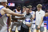 Mar 3, 2026; Gainesville, Florida, USA; Florida Gators head coach Todd Golden celebrates his 100th win with center Viktor Mikic (12), center Rueben Chinyelu (9), center Micah Handlogten (3), forward Alex Condon (21) and forward Thomas Haugh (10) after the game against the Mississippi State Bulldogs at Exactech Arena at the Stephen C. O'Connell Center. Mandatory Credit: Morgan Tencza-Imagn Images