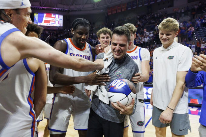 Mar 3, 2026; Gainesville, Florida, USA; Florida Gators head coach Todd Golden celebrates his 100th win with center Viktor Mikic (12), center Rueben Chinyelu (9), center Micah Handlogten (3), forward Alex Condon (21) and forward Thomas Haugh (10) after the game against the Mississippi State Bulldogs at Exactech Arena at the Stephen C. O'Connell Center. Mandatory Credit: Morgan Tencza-Imagn Images