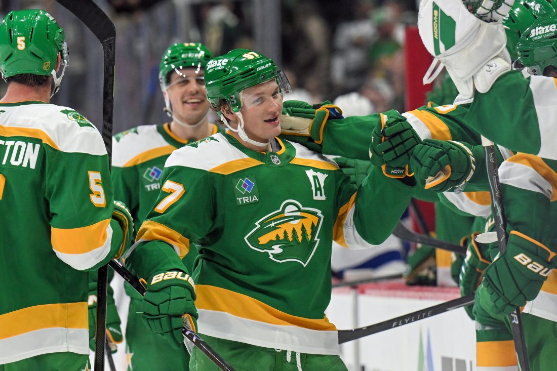 Mar 3, 2026; Saint Paul, Minnesota, USA; Minnesota Wild forward Kirill Kaprizov (97) is congratulated by teammates after taking sole possession as the franchise leader in goals on an empty netter against the Tampa Bay Lightning during the third period at Grand Casino Arena. Mandatory Credit: Nick Wosika-Imagn Images
