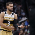 Mar 5, 2026; Washington, District of Columbia, USA; Washington Wizards guard Trae Young (3) stands on the court against the Utah Jazz in the second half at Capital One Arena.