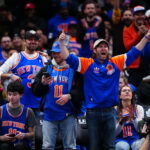 Mar 6, 2026; Denver, Colorado, USA; New York Knicks fans react in the fourth quarter against the Denver Nuggets at Ball Arena. Mandatory Credit: Ron Chenoy-Imagn Images