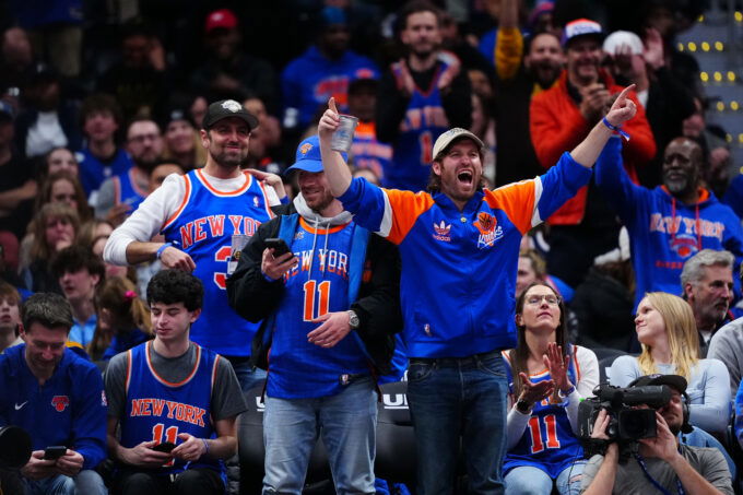 Mar 6, 2026; Denver, Colorado, USA; New York Knicks fans react in the fourth quarter against the Denver Nuggets at Ball Arena. Mandatory Credit: Ron Chenoy-Imagn Images