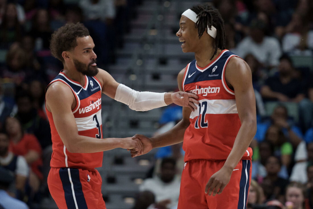 Mar 8, 2026; New Orleans, Louisiana, USA; Washington Wizards guard Trae Young (3) celebrates with guard Tre Johnson (12) during the first half against the New Orleans Pelicans at Smoothie King Center. Mandatory Credit: Matthew Hinton-Imagn Images