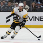 Mar 14, 2026; Salt Lake City, Utah, USA; Pittsburgh Penguins defenseman Parker Wotherspoon (28) skates with the puck against the Utah Mammoth during the third period at Delta Center.