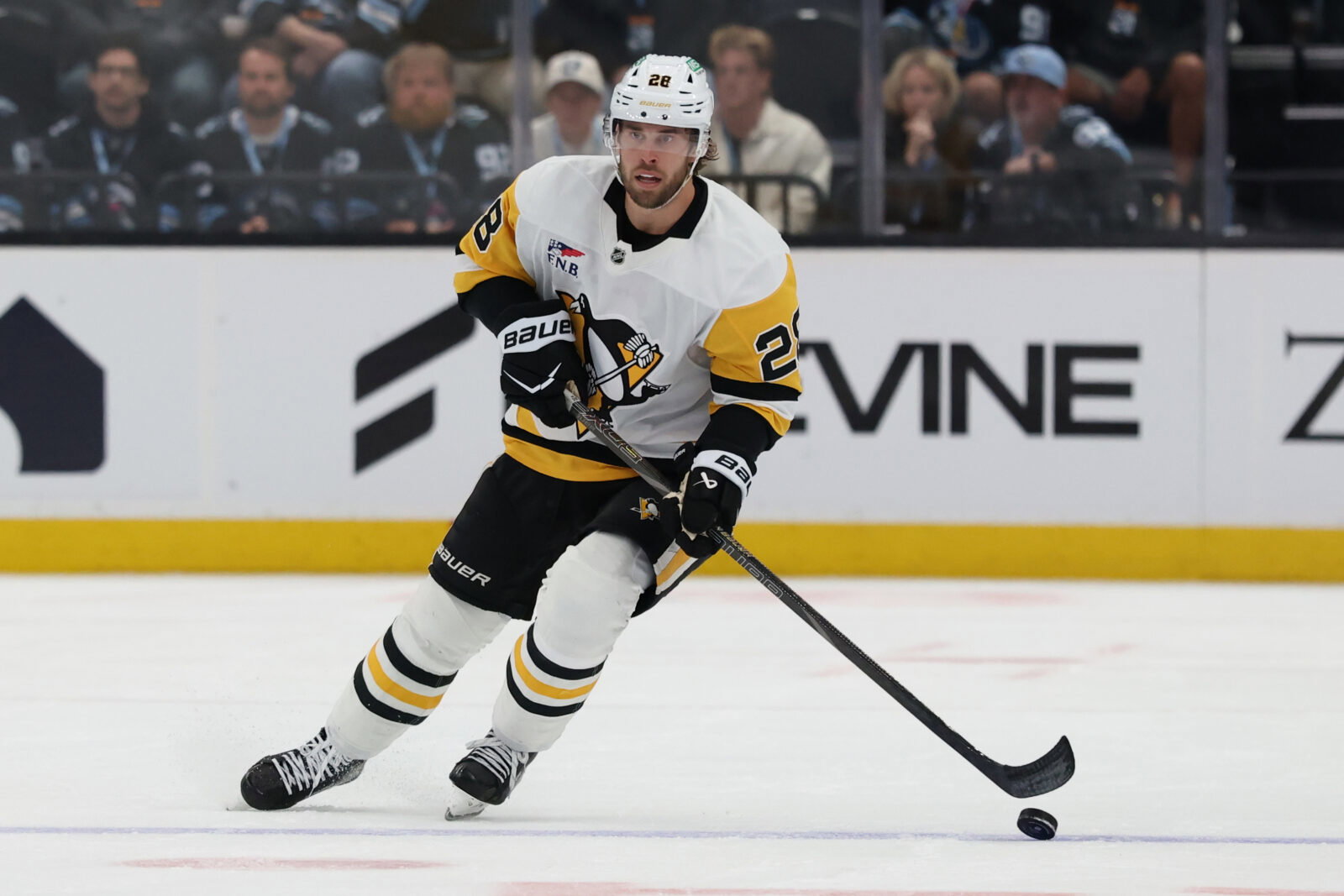 Mar 14, 2026; Salt Lake City, Utah, USA; Pittsburgh Penguins defenseman Parker Wotherspoon (28) skates with the puck against the Utah Mammoth during the third period at Delta Center.