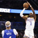 Mar 17, 2026; Orlando, Florida, USA; Oklahoma City Thunder guard Shai Gilgeous-Alexander (2) shoots the ball against the Orlando Magic in the fourth quarter at Kia Center.