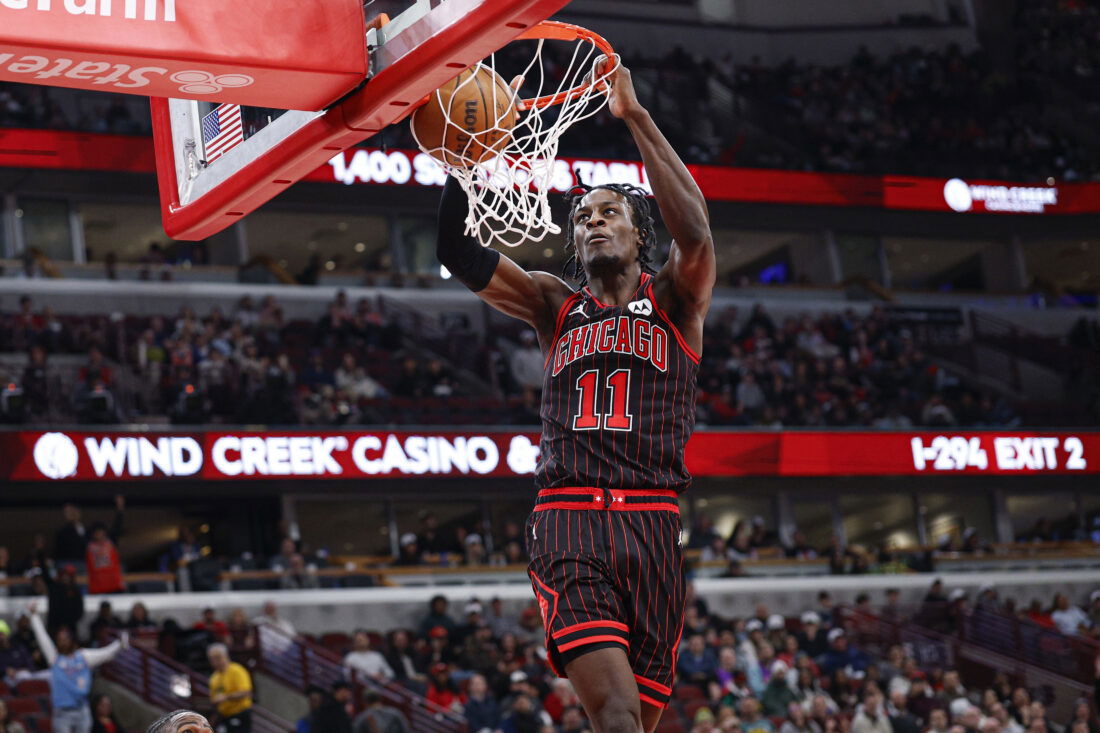 Mar 18, 2026; Chicago, Illinois, USA; Chicago Bulls forward Leonard Miller (11) scores against the Toronto Raptors during the second half at United Center. Mandatory Credit: Kamil Krzaczynski-Imagn Images
