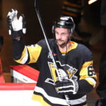 Mar 21, 2026; Pittsburgh, Pennsylvania, USA; Pittsburgh Penguins defenseman Erik Karlsson (65) reacts after being named first star of the game against the Winnipeg Jets at PPG Paints Arena. Mandatory Credit: Charles LeClaire-Imagn Images